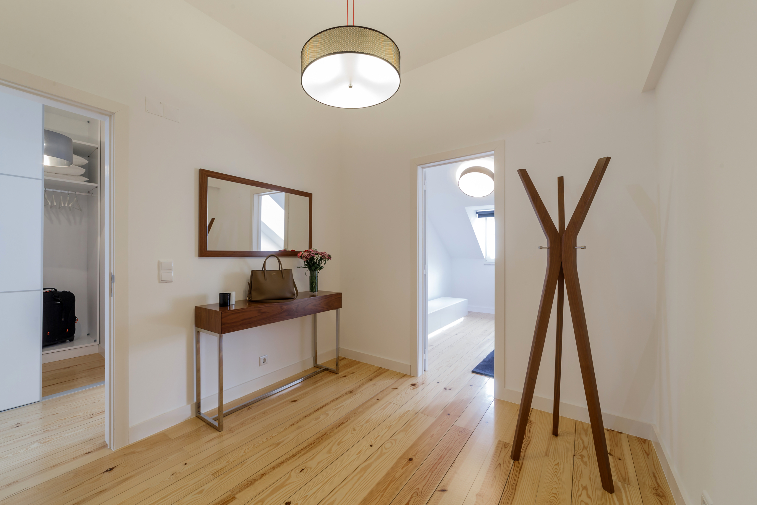 Modern apartment with white walls and light wooden floor Two-bedroom with sauna